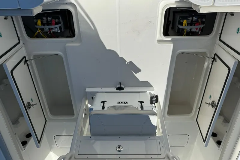 Slide: The Image of 2026 World Cat 235 TE boat interior with open storage compartments and seating. - 34