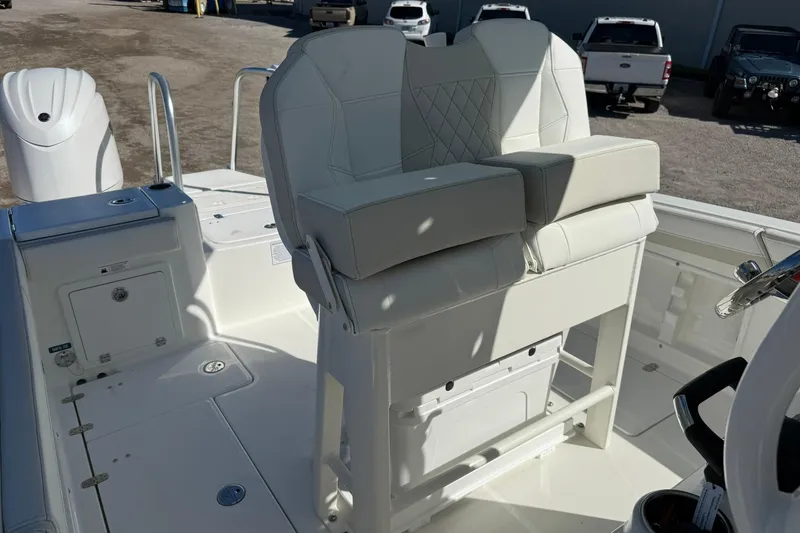Slide: The Image of 2026 World Cat 235 TE boat interior with white seating and storage compartments. - 39