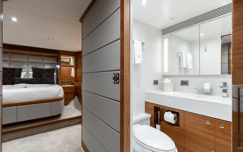 Slide: The Image of Luxurious Horizon FD 92 yacht interior featuring a modern bedroom and bathroom, 2022 model. - 14
