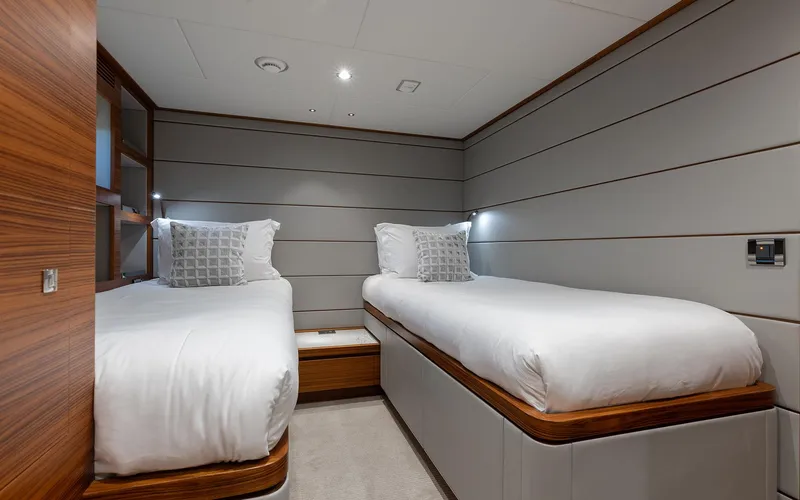 Slide: The Image of Luxurious twin bedroom in 2022 Horizon FD 92 yacht, featuring modern design and cozy bedding. - 15