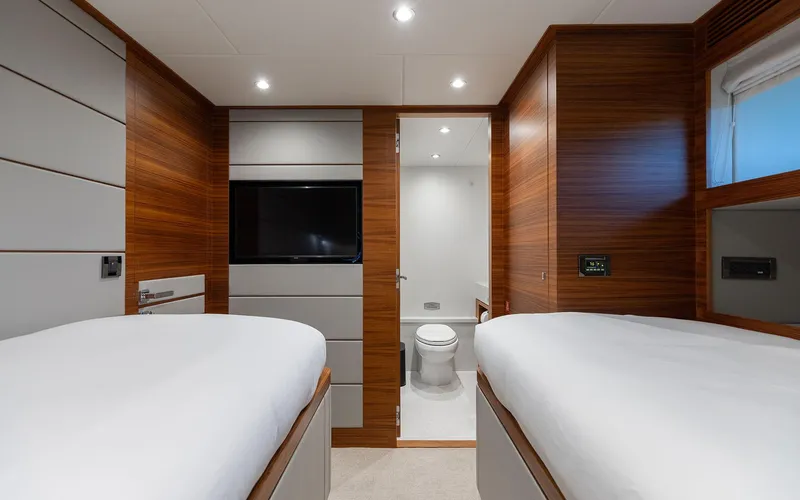 Slide: The Image of Luxurious Horizon FD 92 yacht cabin interior with twin beds and ensuite bathroom, 2022 model. - 16