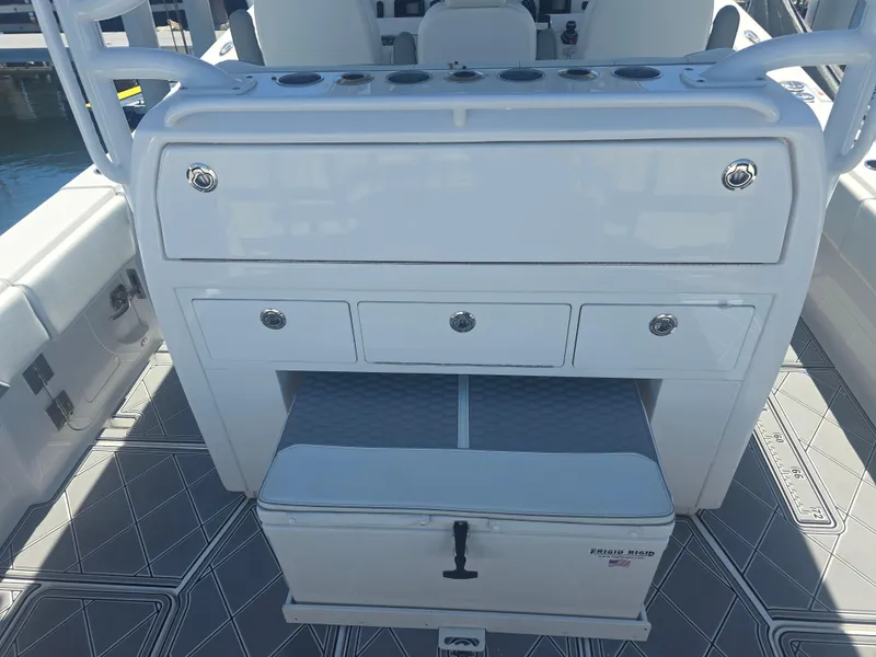 Slide: The Image of 2024 Invincible 43 Open Fisherman boat console with storage drawers and seating. - 14