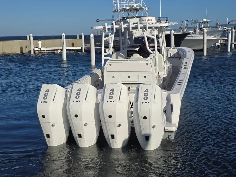 Slide: The Image of 2024 Invincible 43 Open Fisherman boat with four powerful V10 engines docked in marina. - 32