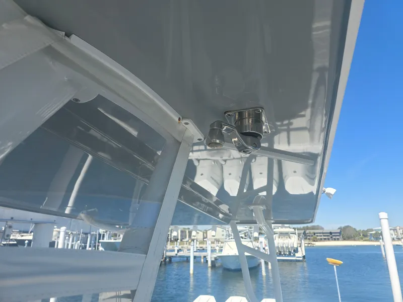 Slide: The Image of 2024 Invincible 43 Open Fisherman boat detail with marina background. - 6