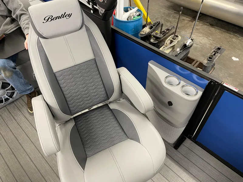 Slide: The Image of 2025 Bentley Pontoons Elite 253 Swingback Tower seat with cup holders and modern design. - 11