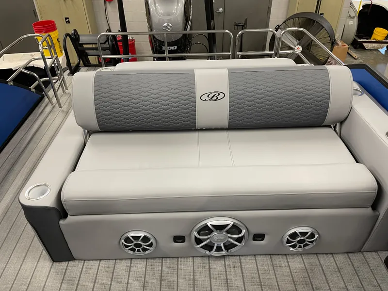 Slide: The Image of 2025 Bentley Pontoons Elite 253 Swingback Tower seating with integrated speakers and cup holders. - 13