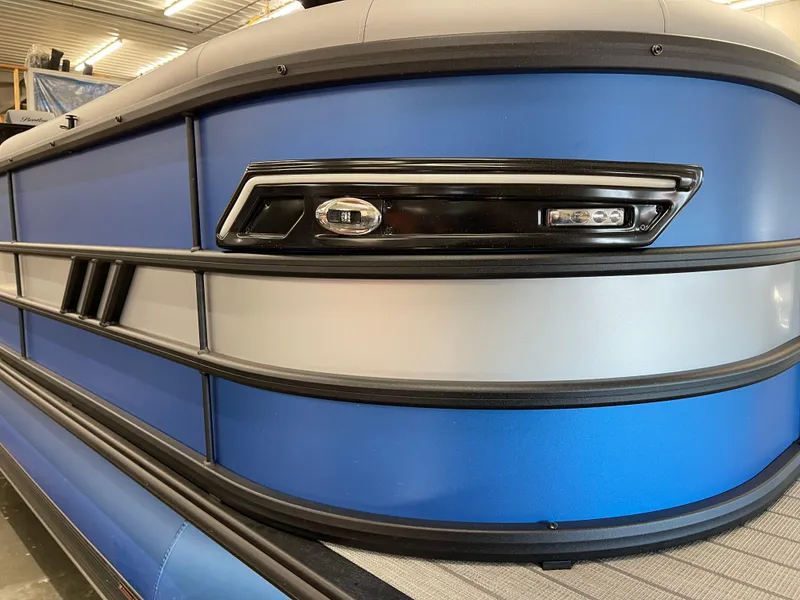 Slide: The Image of 2025 Bentley Pontoons Elite 253 Swingback Tower, sleek blue exterior detail. - 3