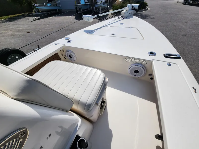 Slide: The Image of 2020 Hewes Redfisher 18 boat interior with seating and speakers, showcasing sleek design. - 10