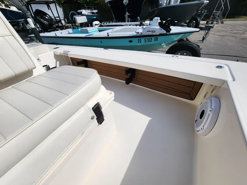 Slide: The Image of 2020 Hewes Redfisher 18 boat interior with seating and storage compartments. - 11