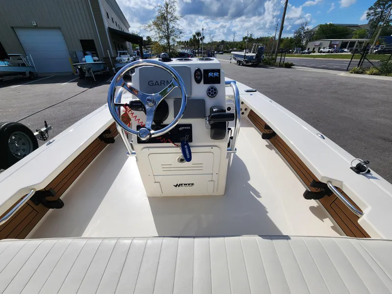 Slide: The Image of 2020 Hewes Redfisher 18 boat interior with steering console and Garmin equipment. - 4