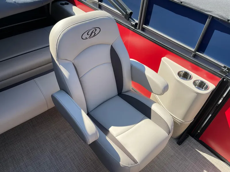 Slide: The Image of 2025 Bentley Pontoons Legacy 200 Swingback seat with cup holders, featuring luxurious design. - 12
