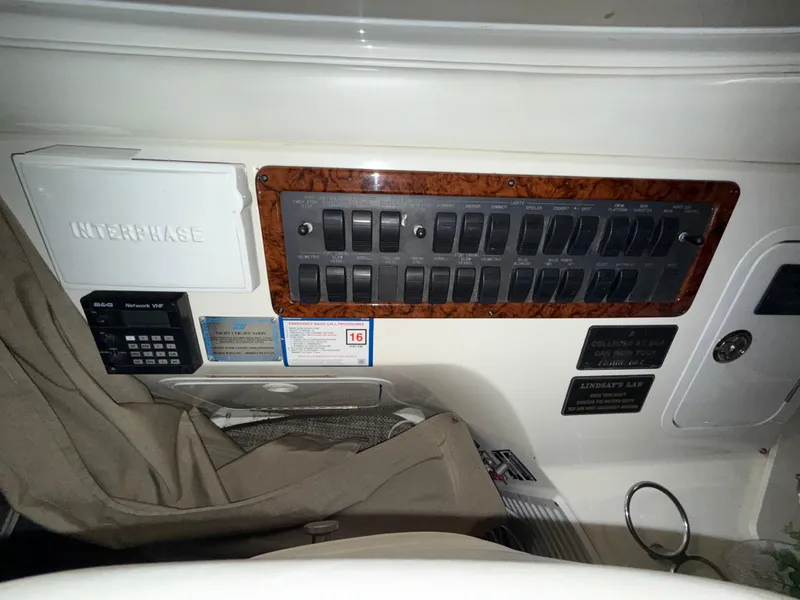 Slide: The Image of Control panel of a 2000 Sea Ray 510 Sundancer yacht with switches and labels. - 10