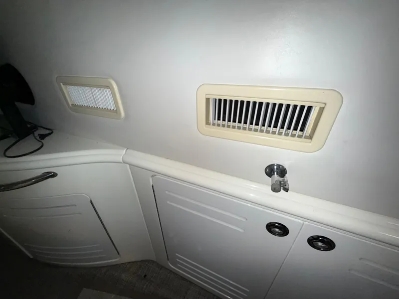 Slide: The Image of Interior vents and cabinetry on a 2000 Sea Ray 510 Sundancer yacht. - 11