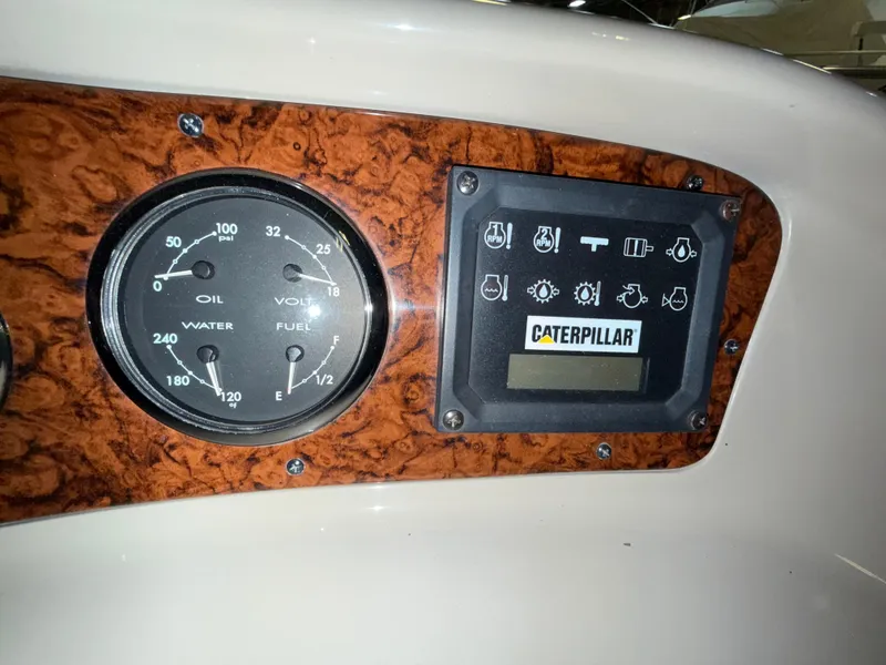 Slide: The Image of Dashboard of 2000 Sea Ray 510 Sundancer with Caterpillar engine gauges. - 17