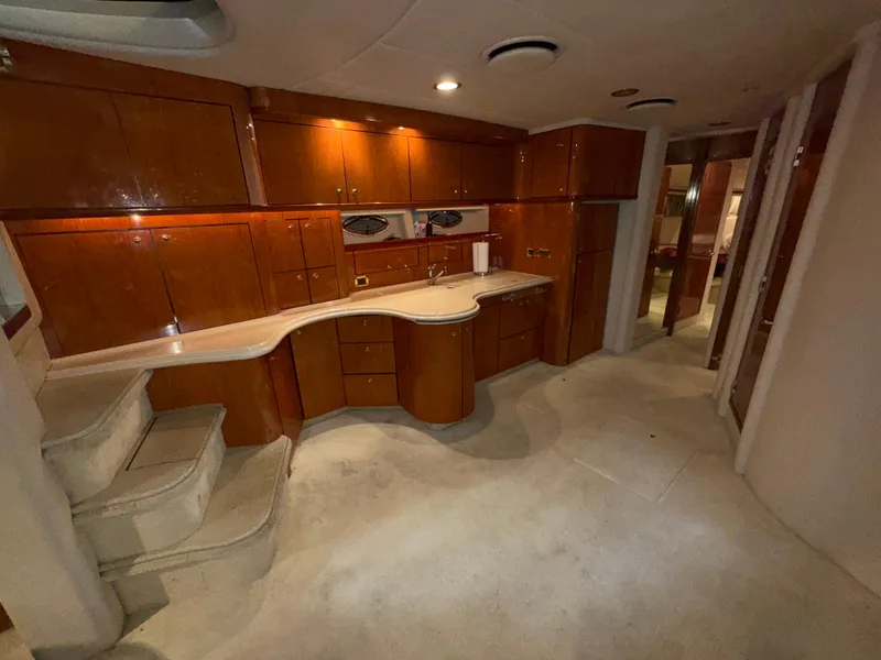 Slide: The Image of Interior of 2000 Sea Ray 510 Sundancer yacht with wooden cabinetry and modern design. - 21