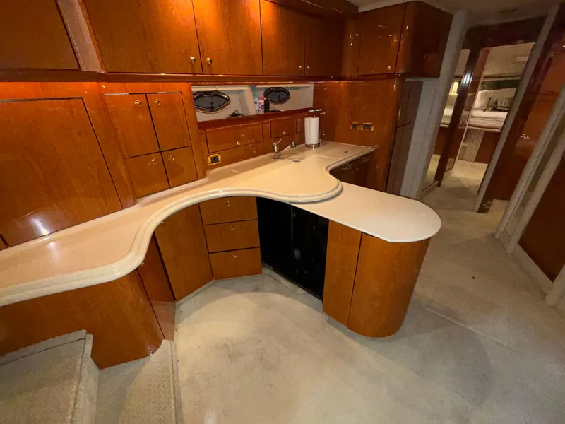 Slide: The Image of Luxurious interior of 2000 Sea Ray 510 Sundancer yacht with elegant wood cabinetry. - 23