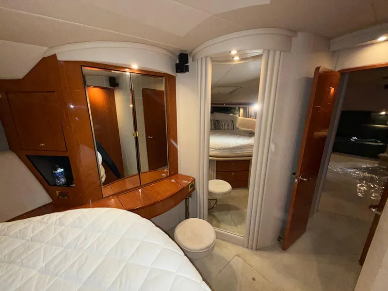 Slide: The Image of Luxurious interior of 2000 Sea Ray 510 Sundancer yacht with elegant wood finishes. - 29
