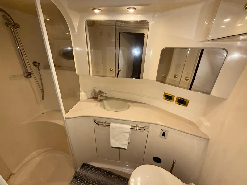 Slide: The Image of Luxurious bathroom in 2000 Sea Ray 510 Sundancer yacht with modern fixtures and shower. - 32