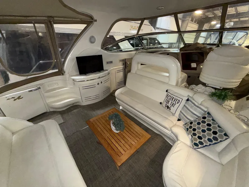 Slide: The Image of Luxurious interior of 2000 Sea Ray 510 Sundancer yacht with plush seating and decor. - 6