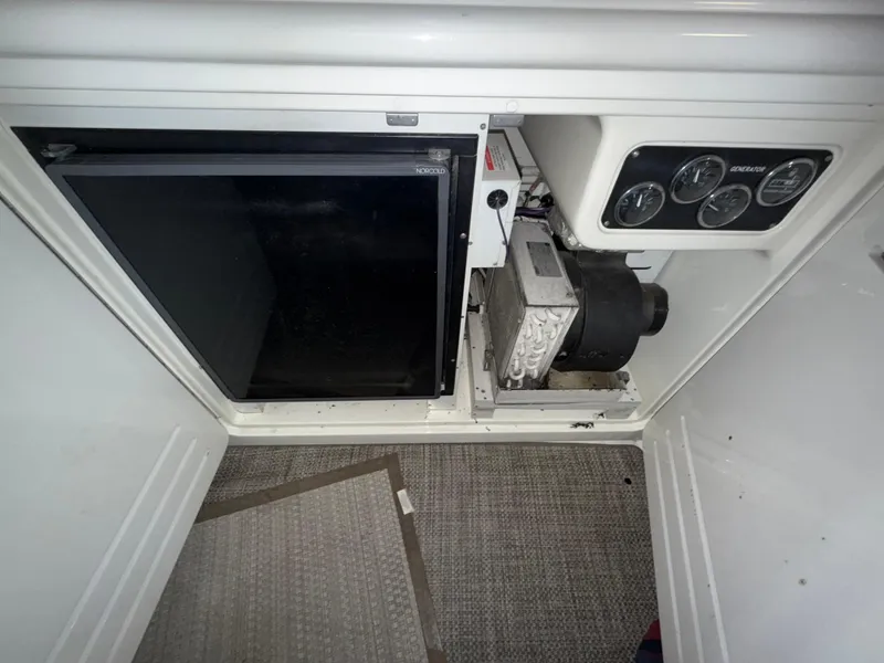 Slide: The Image of Interior view of a 2000 Sea Ray 510 Sundancer boat's control panel and equipment. - 9