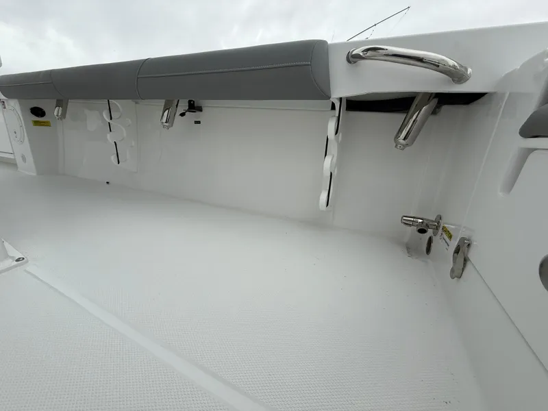 Slide: The Image of 2025 Everglades 253 Center Console boat interior with sleek white finish and stainless steel fittings. - 11