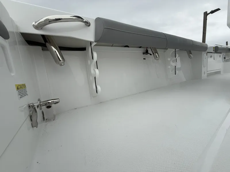 Slide: The Image of 2025 Everglades 253 Center Console boat interior with sleek white finish and stainless steel fixtures. - 12