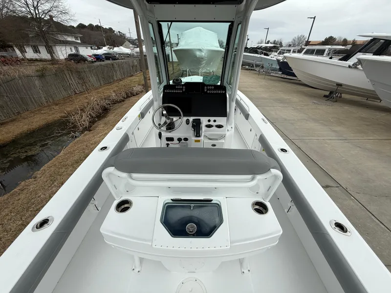 Slide: The Image of 2025 Everglades 253 Center Console boat interior with helm and seating area. - 13