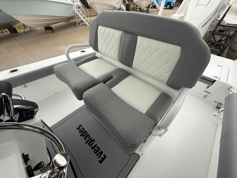 Slide: The Image of 2025 Everglades 253 Center Console boat interior with gray and white seating. - 15