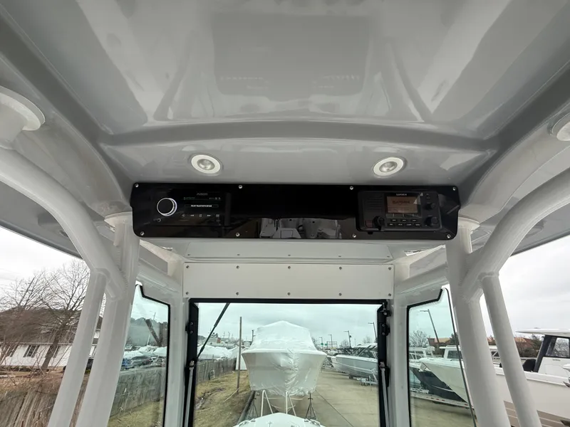 Slide: The Image of 2025 Everglades 253 Center Console boat interior with modern control panel. - 18