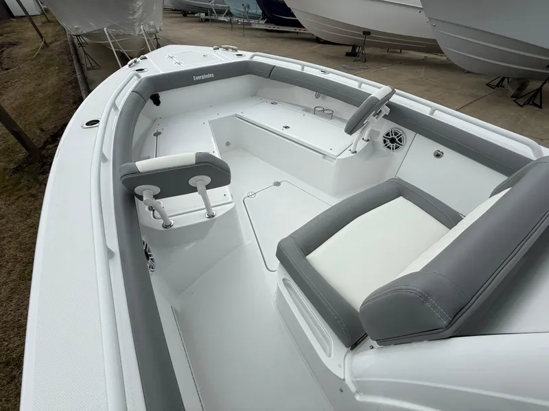 Slide: The Image of 2025 Everglades 253 Center Console boat interior with gray and white seating. - 21