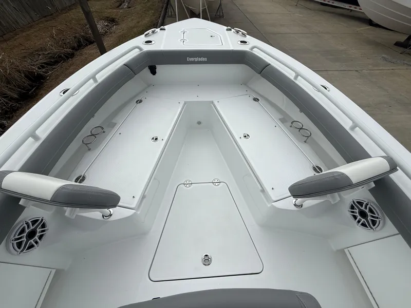 Slide: The Image of 2025 Everglades 253 Center Console boat interior with seating and storage compartments. - 22