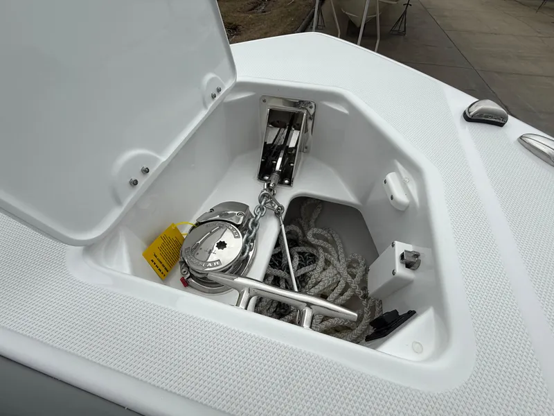 Slide: The Image of 2025 Everglades 253 Center Console anchor storage with chain and rope. - 25