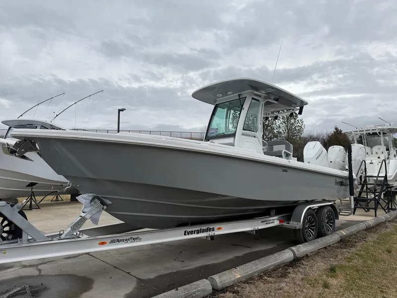 Slide: The Image of 2025 Everglades 253 Center Console boat on trailer, overcast sky background. - 3