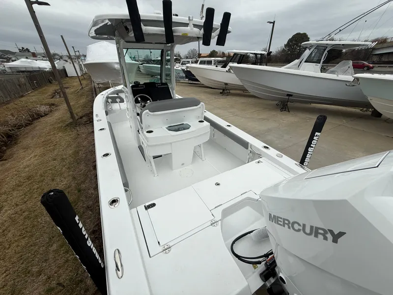 Slide: The Image of 2025 Everglades 253 Center Console boat with Mercury engine, docked outdoors. - 7