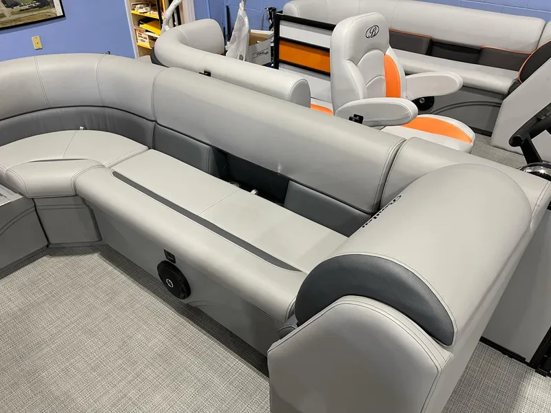 Slide: The Image of 2025 Bentley Pontoons Legacy 200 Cruise XL interior with gray seating and orange accents. - 11