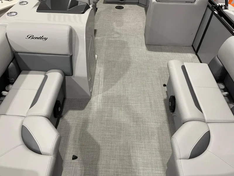 Slide: The Image of 2025 Bentley Pontoons Legacy 200 Cruise XL interior with gray seating and carpet. - 3