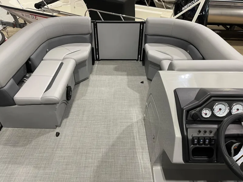 Slide: The Image of 2025 Bentley Pontoons Legacy 200 Cruise XL interior with gray seating and modern dashboard. - 5
