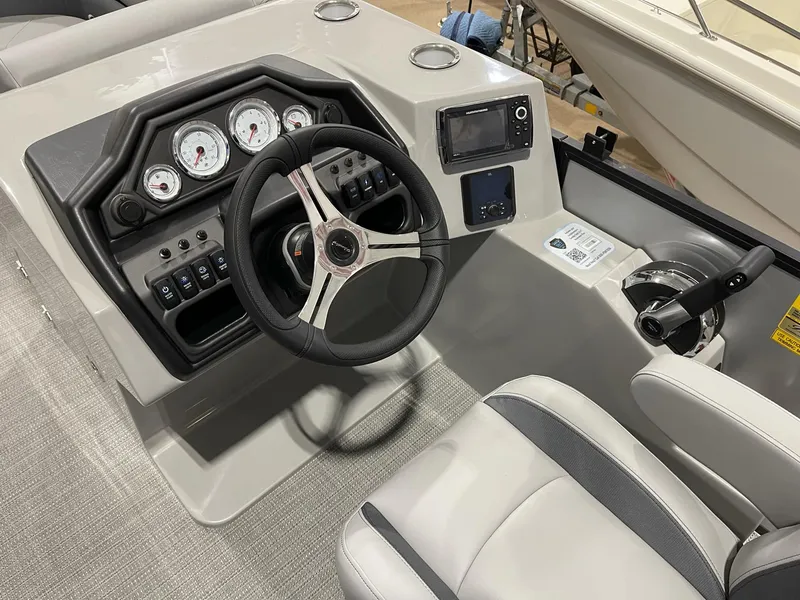 Slide: The Image of 2025 Bentley Pontoons Legacy 200 Cruise XL dashboard with steering wheel and control panel. - 6
