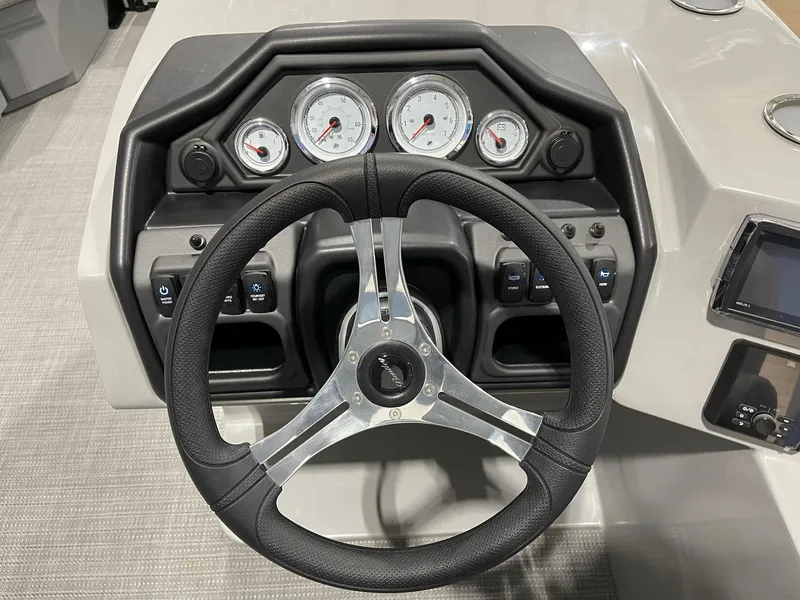 Slide: The Image of 2025 Bentley Pontoons Legacy 200 Cruise XL dashboard with steering wheel and gauges. - 7