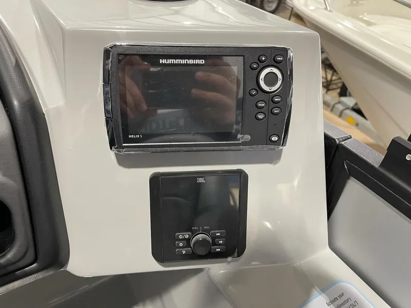 Slide: The Image of Control panel of 2025 Bentley Pontoons Legacy 200 Cruise XL with Humminbird and JBL systems. - 8