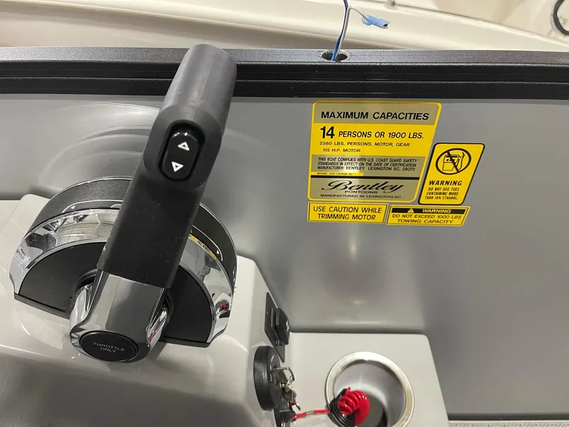 Slide: The Image of 2025 Bentley Pontoons Legacy 200 Cruise XL control panel with capacity warning label. - 9