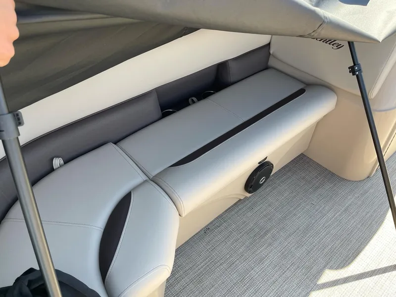 Slide: The Image of 2025 Bentley Pontoons LE 200 CW interior seating with beige and black upholstery. - 10