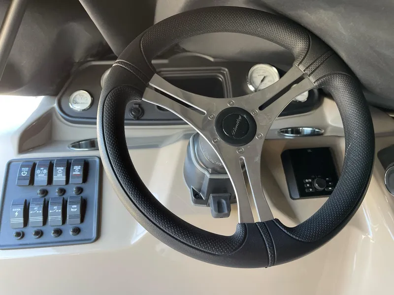 Slide: The Image of Steering wheel and dashboard of 2025 Bentley Pontoons LE 200 CW boat. - 14