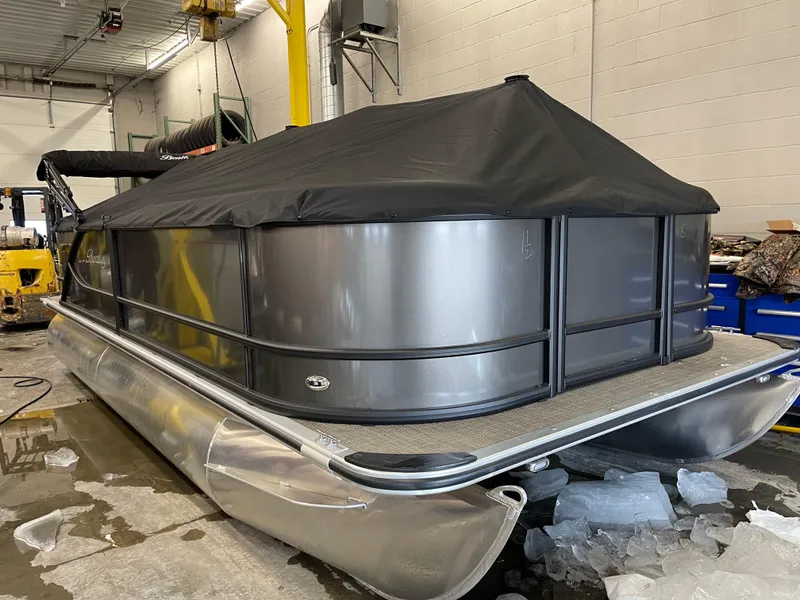 Slide: The Image of 2025 Bentley Pontoons LE 200 CW covered in a garage setting. - 3