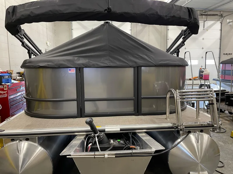 Slide: The Image of 2025 Bentley Pontoons LE 200 CW pontoon boat in a garage setting. - 7