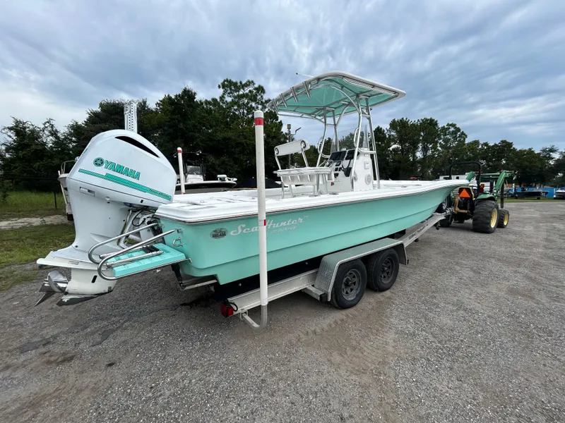 Slide: The Image of 2012 SeaHunter 24 Bay boat on trailer with Yamaha outboard motor. - 4