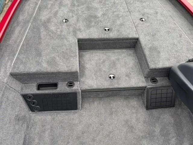 Slide: The Image of 2025 Tracker Savage 215 boat storage compartment with organized interior and fire extinguisher. - 14