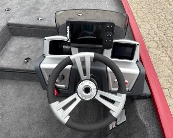 Slide: The Image of 2025 Tracker Savage 215 boat dashboard with Garmin navigation system. - 17