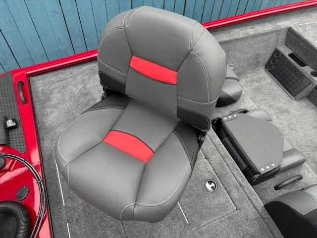 Slide: The Image of 2025 Tracker Savage 215 boat interior with gray and red seating. - 23