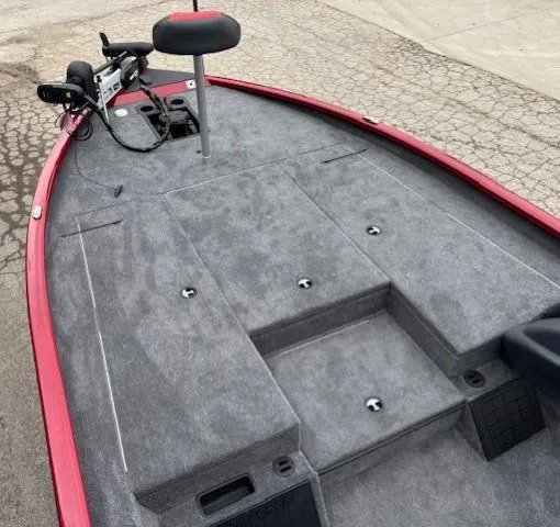 Slide: The Image of 2025 Tracker Savage 215 boat deck with red trim and carpeted surface. - 6